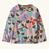 Patagonia 100% recycled polyester little kids micro d pullover jumper in pale pink with a repeating retro floral design