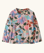 Patagonia 100% recycled polyester little kids micro d pullover jumper in pale pink with a repeating retro floral design