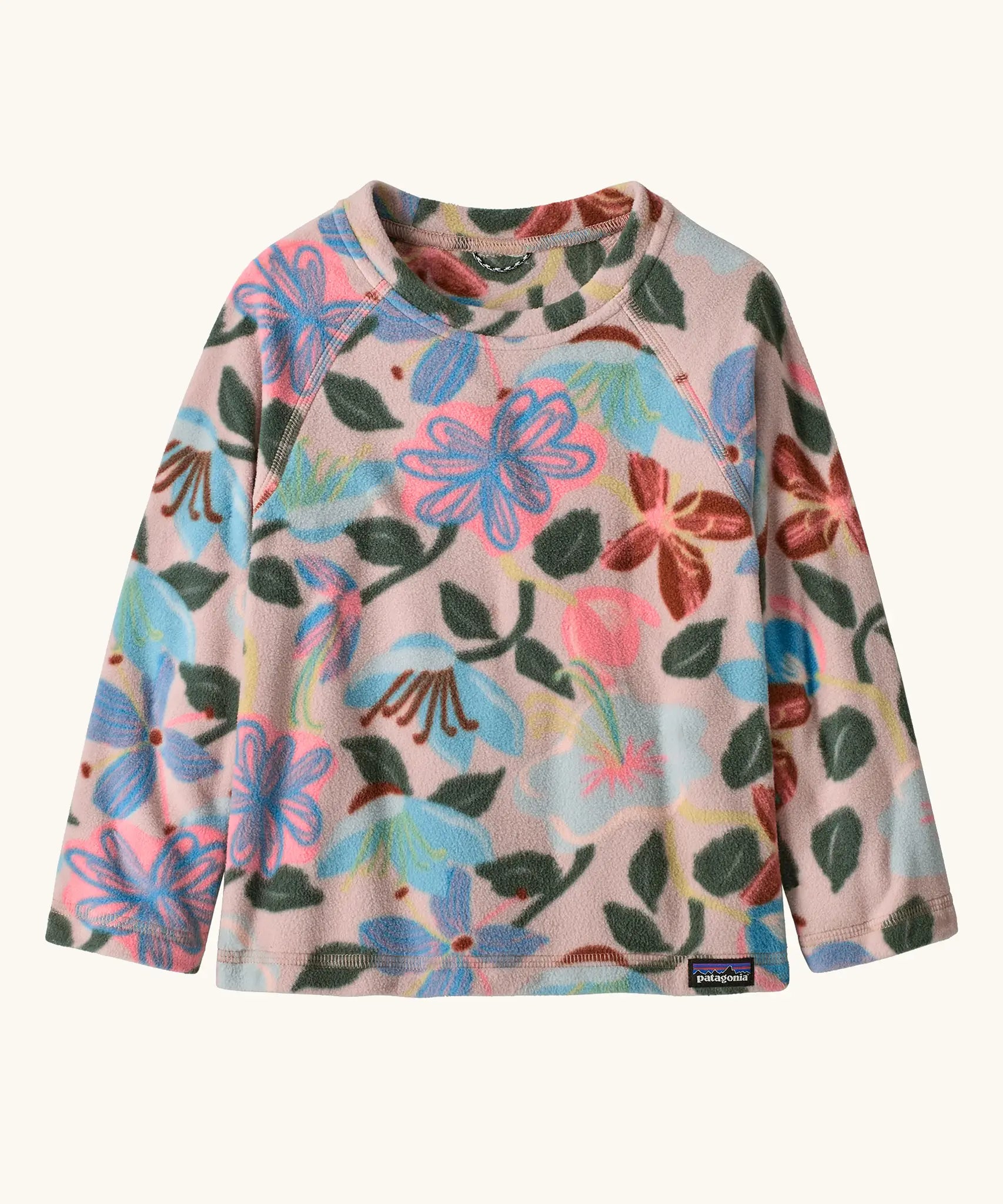 Patagonia 100% recycled polyester little kids micro d pullover jumper in pale pink with a repeating retro floral design