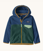Patagonia little kids micro d snap t jacket in cascade green available at Babipur. A 100% recycled polyester soft fleece hooded jacket in dark navy and green with dark yellow trim. Features a full length zip and small chest pocket with a green flap