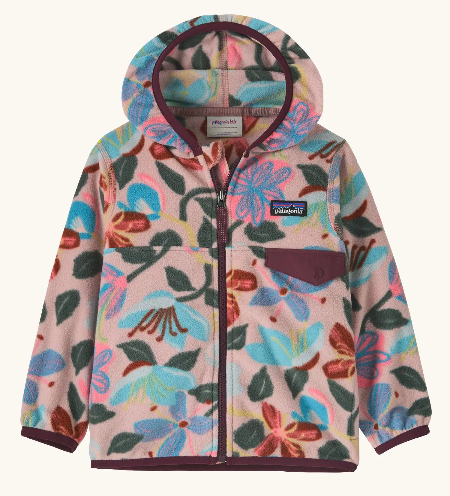 Patagonia 100% recycled polyester little kids micro d snap t hooded jacket in pale pink repeating retro floral design. Shows a full front zip and chest pocket