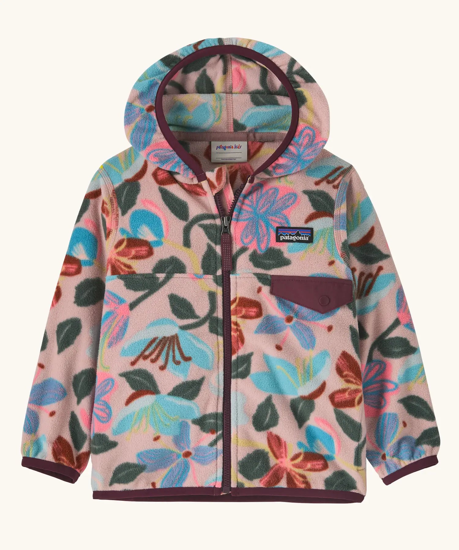 Patagonia 100% recycled polyester little kids micro d snap t hooded jacket in pale pink repeating retro floral design. Shows a full front zip and chest pocket