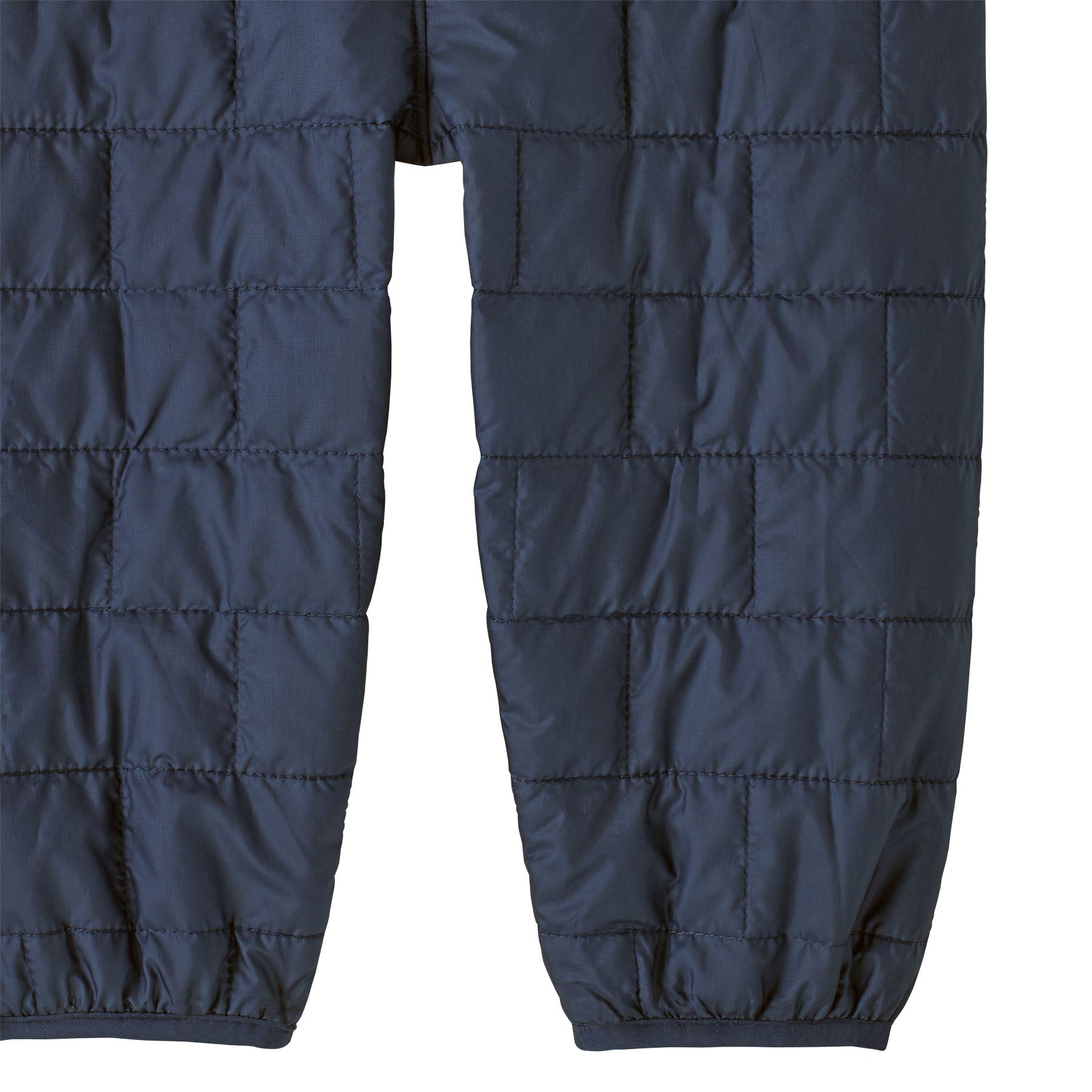 Patagonia kids nano puffer winter overalls in navy available at Babipur  showing the leg cuff detail.