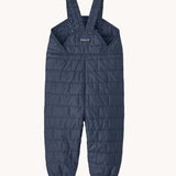 The back of the Patagonia kids nano puffer winter overalls in navy available at Babipur . Features popper fasteners on each shoulder strap for size adjustment. 