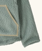 Patagonia little kids retro pile soft fleece hooded jacket in sage green showing close up of the front pocket with muted trim