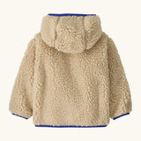 Back of Patagonia little kids retro x pile fleece hooded jacket in beige showing a blue trim on the cuff and hem
