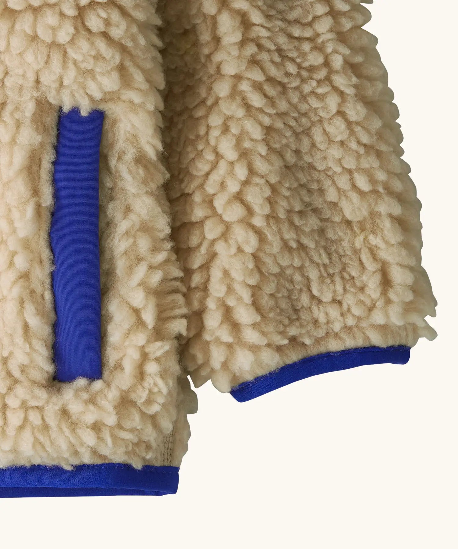 Patagonia little kids retro x pile fleece hooded jacket in beige showing coloured cuff and hem trim and side pocket