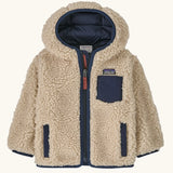 Patagonia little kids retro x pile windproof hooded fleece jacket in beige with a navy inner. Shows a full front zip, side and chest pockets