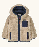 Patagonia little kids retro x pile windproof hooded fleece jacket in beige with a navy inner. Shows a full front zip, side and chest pockets