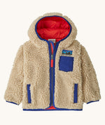 Patagonia little kids retro x hoody in dark natural available at Babipur. A 100% recycled polyester thick pile fleece hooded jacket in cream with blue trim Features a full length zip, 2 side pockets and a small chest pocket