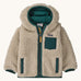 Patagonia little kids retro x hoody in dark natural /cascade green available at Babipur. A 100% recycled polyester thick pile fleece hooded jacket in cream with dark green trim Features a full length zip, 2 side pockets and a small chest pocket