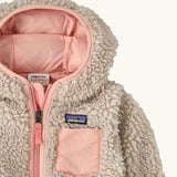 Patagonia little kids retro x pile windproof hooded fleece jacket in beige with a pink inner showing a close up of the pink chest pocket and front zip detail