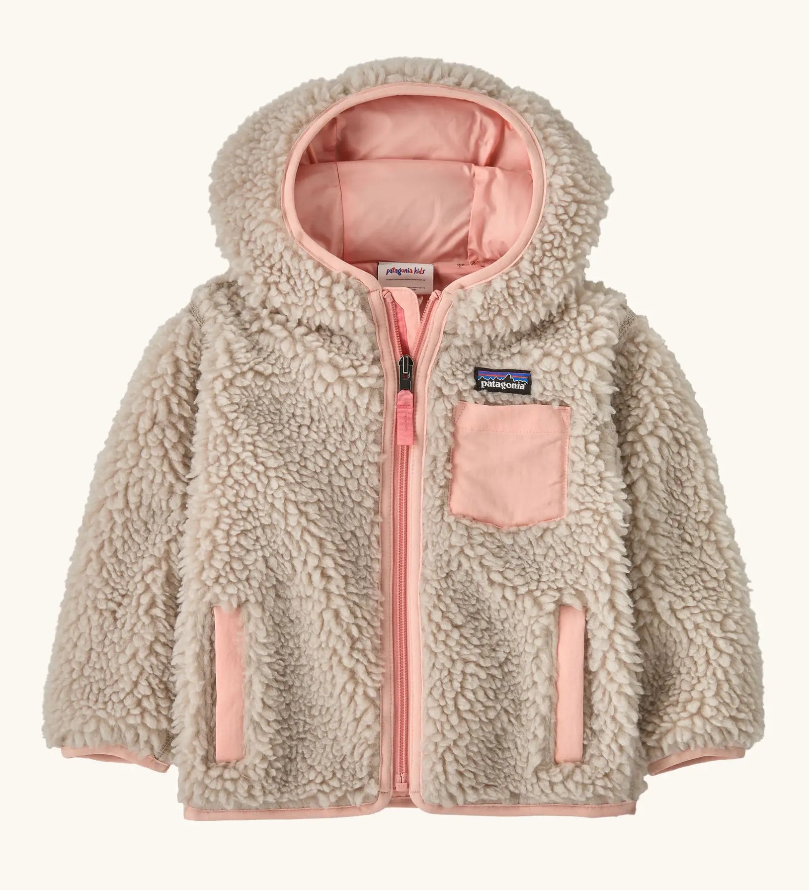 Patagonia little kids retro x pile windproof hooded fleece jacket in beige with a pink inner. Shows a full front zip, side and chest pockets
