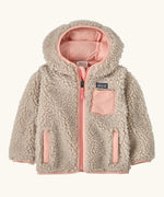 Patagonia little kids retro x pile windproof hooded fleece jacket in beige with a pink inner. Shows a full front zip, side and chest pockets