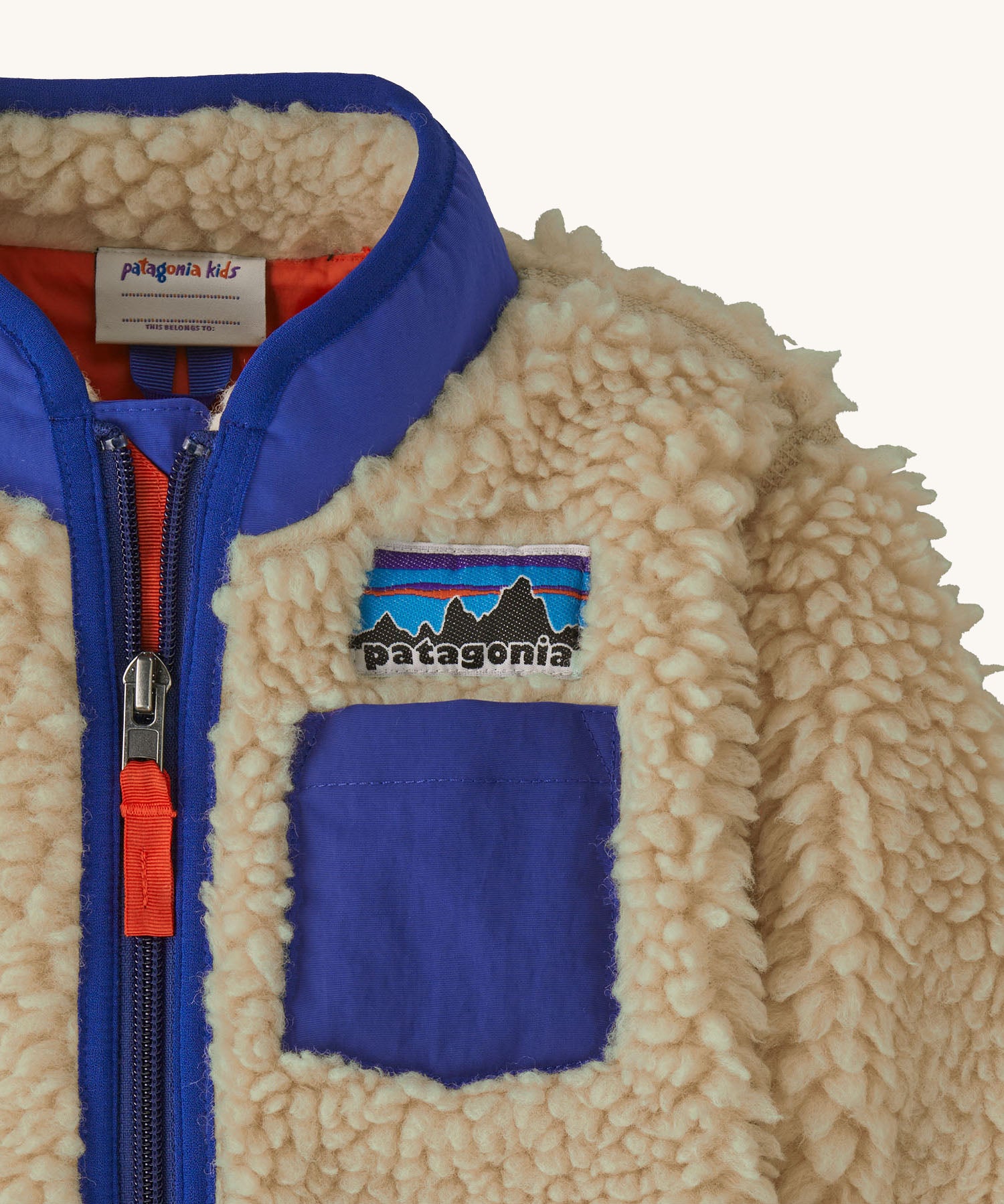 Patagonia little kids retro x pile fleece jacket in neutral showing stand up collar and small chest pocket