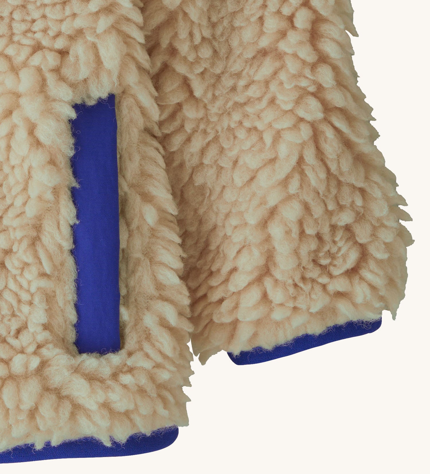 Patagonia little kids retro x pile fleece jacket in neutral showing close up of coloured hem, cuff and side pocket