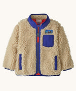 Patagonia little kids retro x jacket in dark natural available at Babipur. A 100% recycled polyester and pile fleece jacket in cream with dark blue trim. Features a full length zip, 2 side pockets and a chest pocket