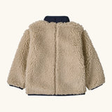 Back of Patagonia little kids retro x pile fleece jacket in neutral with a navy turned up collar