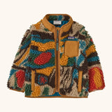 Patagonia little kids retro x pile fleece jacket with a colourful pattern and brown trim. Shows a full front zip, side and chest pockets