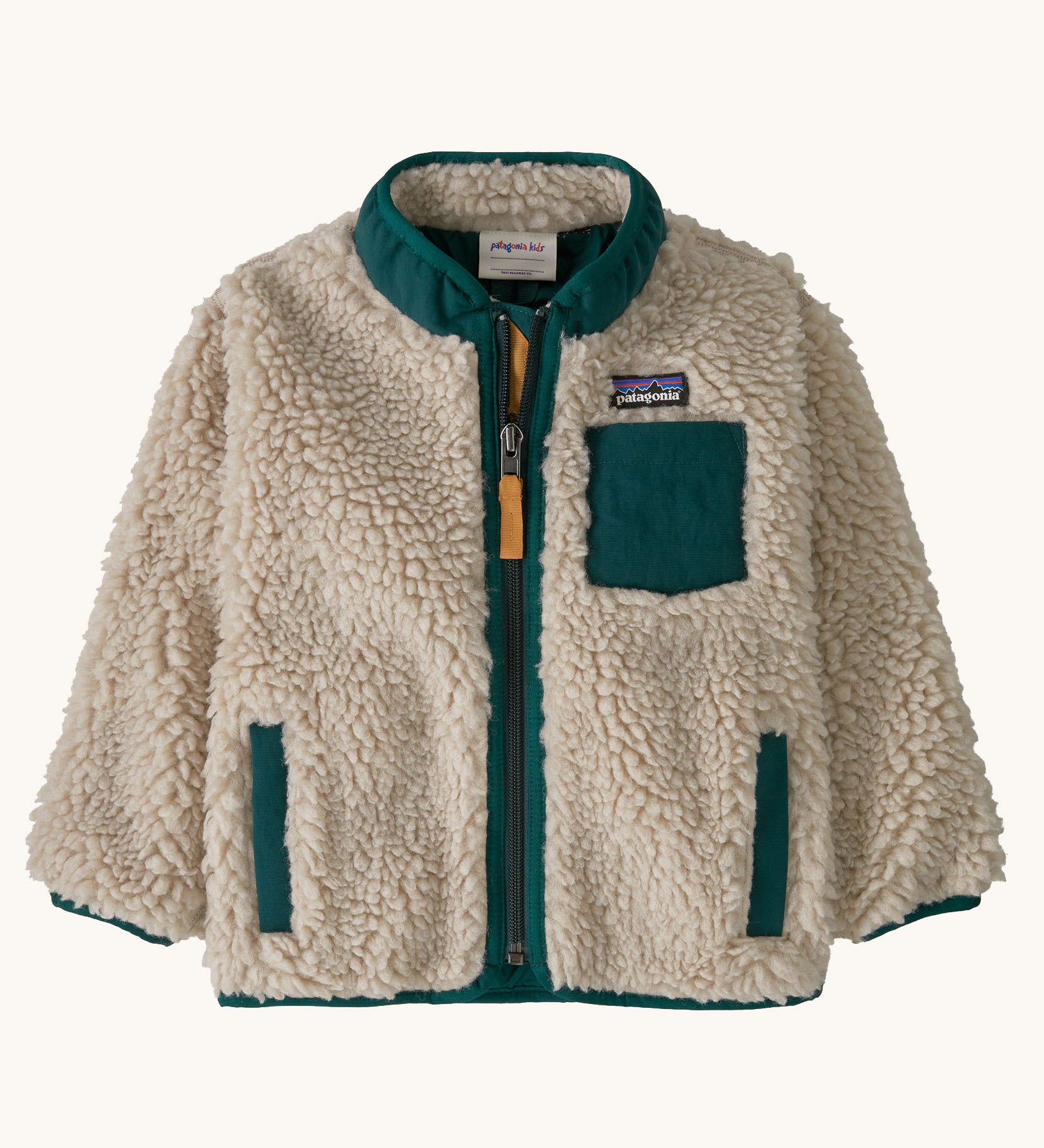 Patagonia little kids retro x jacket in dark natural/cascade green available at Babipur. A 100% recycled polyester and pile fleece jacket in cream with dark green trim. Features a full length zip, 2 side pockets and a chest pocket