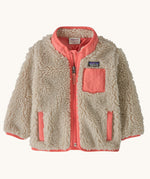 Patagonia little kids retro x jacket in dark natural/ sparkle pink available at Babipur. A 100% recycled polyester and pile fleece jacket in cream with pink  trim. Features a full length zip, 2 side pockets and a chest pocket