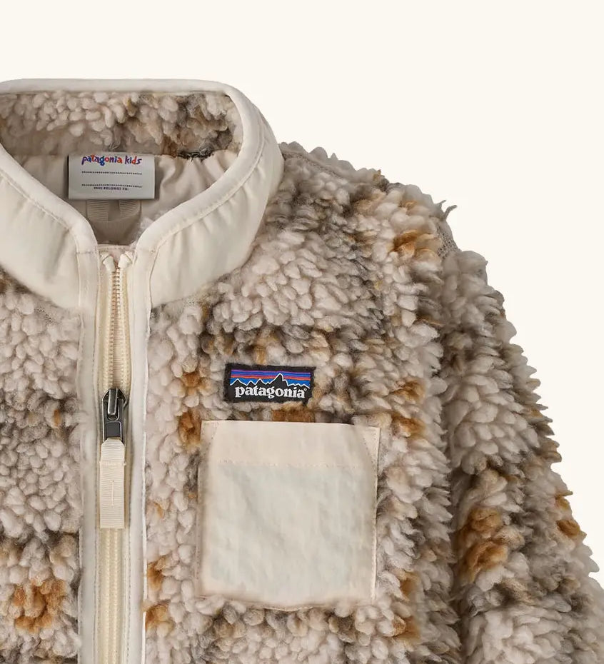 Patagonia little kids retro x pile fleece jacket in warm brown pattern showing a close up of the neutral turn up collar and chest pocket