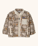 Patagonia little kids retro x pile fleece jacket in neutral with a warm brown pattern. Shows a full front zip, side and chest pockets
