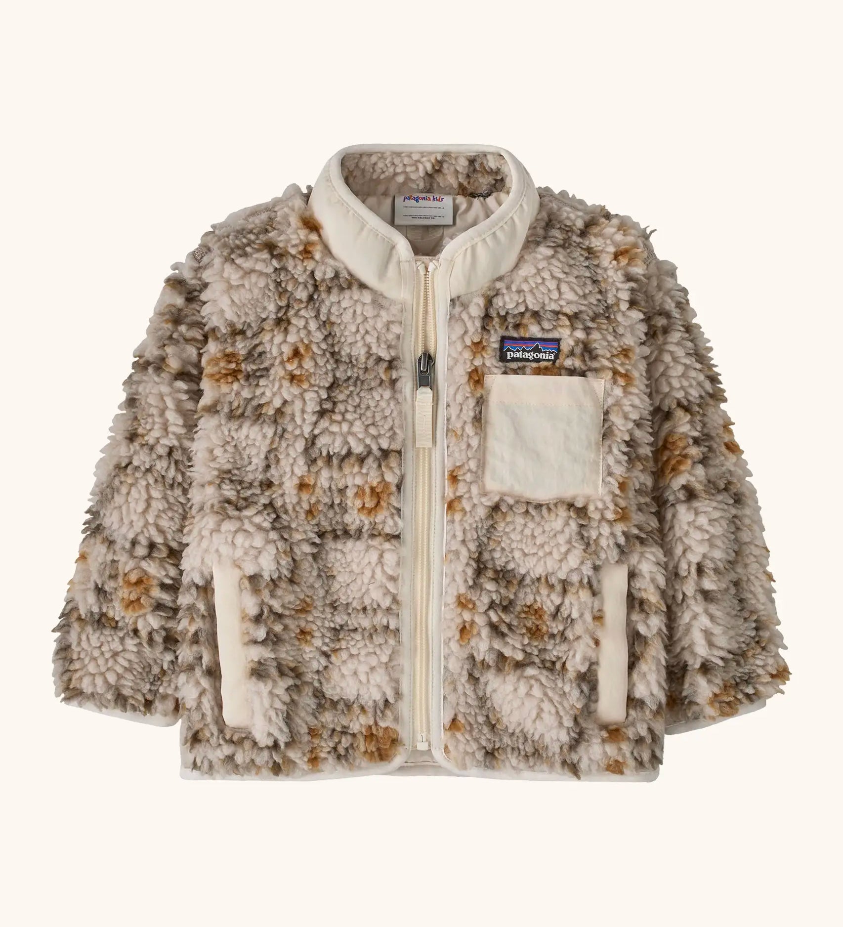 Patagonia little kids retro x pile fleece jacket in neutral with a warm brown pattern. Shows a full front zip, side and chest pockets