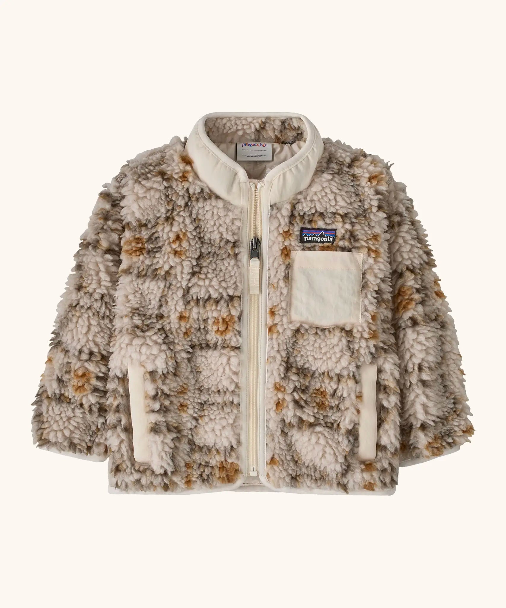 Patagonia little kids retro x pile fleece jacket in neutral with a warm brown pattern. Shows a full front zip, side and chest pockets