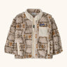 Patagonia little kids retro x pile fleece jacket in neutral with a warm brown pattern. Shows a full front zip, side and chest pockets