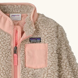 Patagonia little kids retro x pile fleece jacket in neutral showing close up of the pink turn up collar and chest pocket