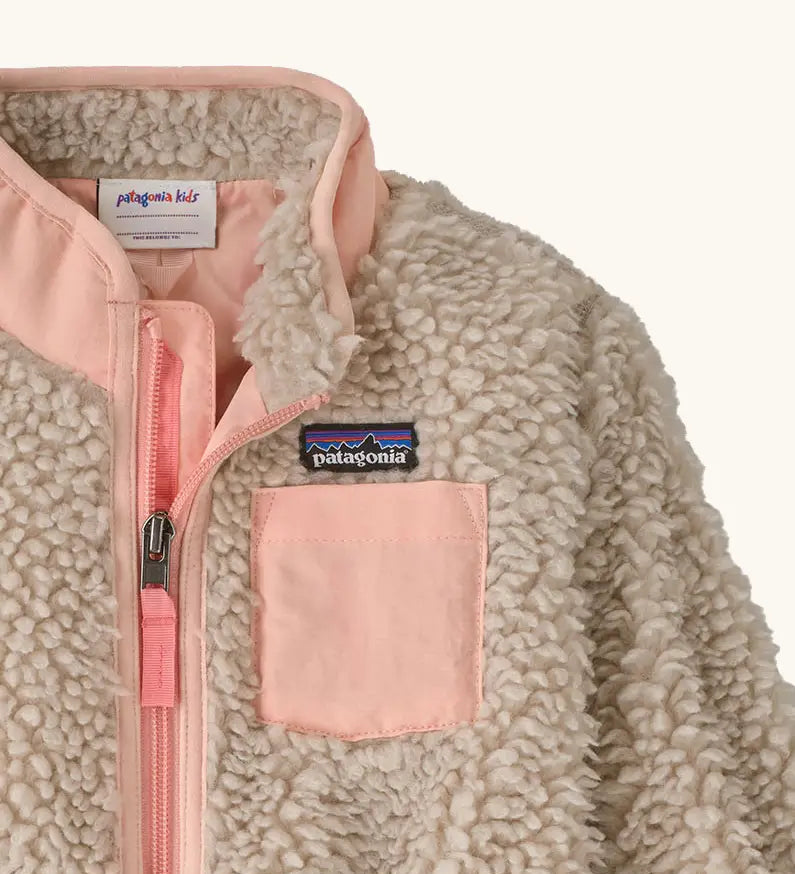 Patagonia little kids retro x pile fleece jacket in neutral showing close up of the pink turn up collar and chest pocket