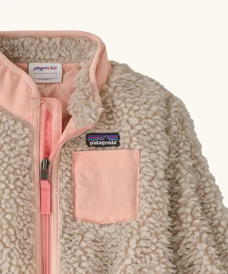 Patagonia little kids retro x pile fleece jacket in neutral showing close up of the pink turn up collar and chest pocket