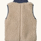 Back of Patagonia 100% recycled polyester little kids retro x high pile fleece vest in beige with a navy turned up collar 