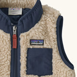 Patagonia 100% recycled polyester little kids retro x high pile fleece vest in beige   showing close up of the navy turned up collar and chest pocket
