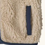Patagonia 100% recycled polyester little kids retro x high pile fleece vest in beige   showing close up of side pocket with navy trim