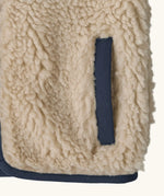 Patagonia 100% recycled polyester little kids retro x high pile fleece vest in beige   showing close up of side pocket with navy trim