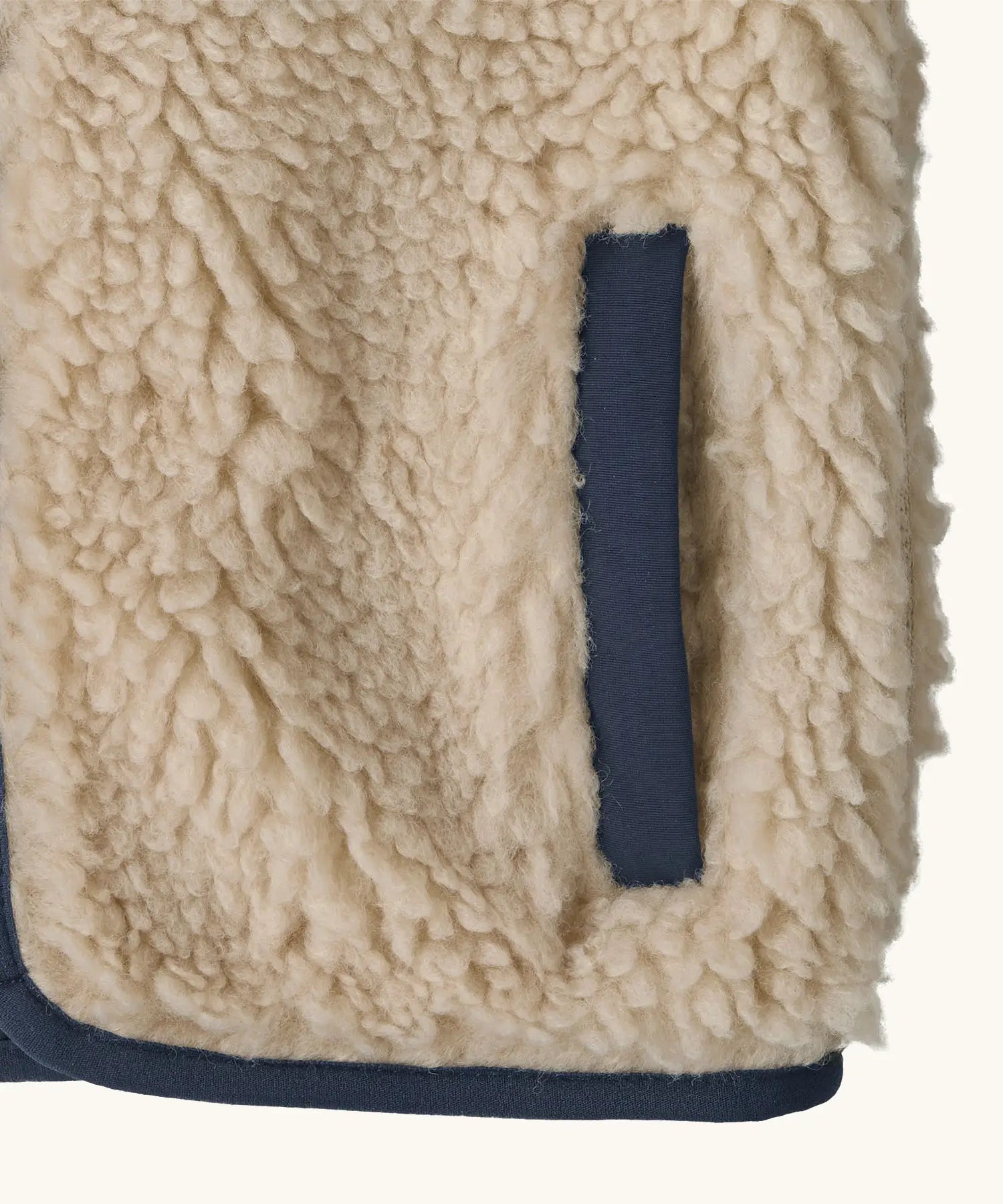 Patagonia 100% recycled polyester little kids retro x high pile fleece vest in beige   showing close up of side pocket with navy trim