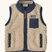 Patagonia 100% recycled polyester little kids retro x high pile fleece vest in beige   with navy trim. Features a full length zip, side and chest pockets 