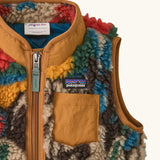 Patagonia 100% recycled polyester little kids retro x high pile fleece vest with abstract design showing close up of brown chest pocket and turn up collar
