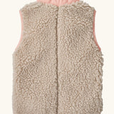 Back of Patagonia 100% recycled polyester little kids retro x high pile fleece vest in beige with a pink turn up collar 