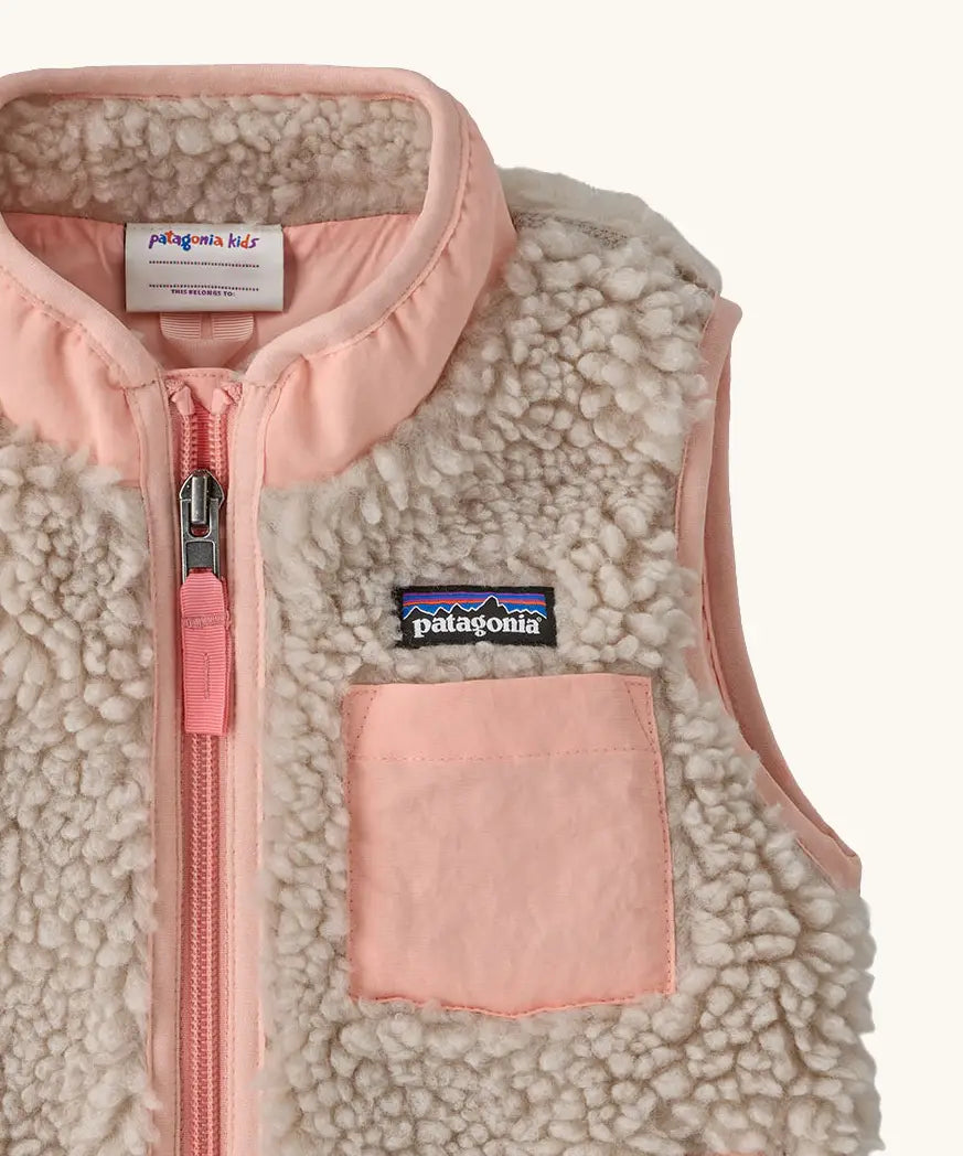 Patagonia 100% recycled polyester little kids retro x high pile fleece vest in beige   with showing close up of a pink turn up collar and chest pocket