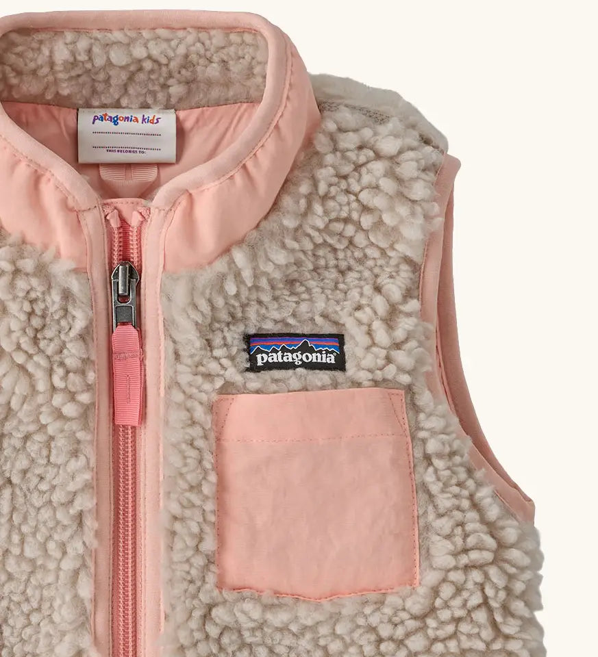 Patagonia 100% recycled polyester little kids retro x high pile fleece vest in beige   with showing close up of a pink turn up collar and chest pocket