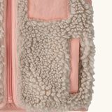Patagonia 100% recycled polyester little kids retro x high pile fleece vest in beige   with showing close up of a side pocket with pink trim