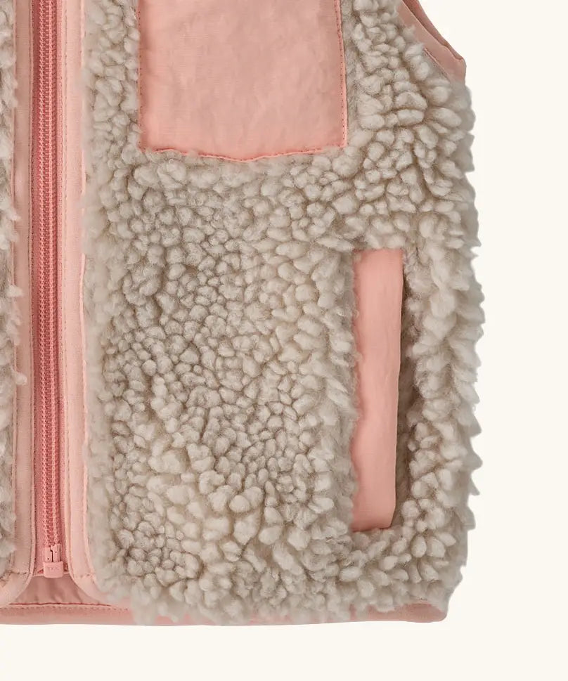 Patagonia 100% recycled polyester little kids retro x high pile fleece vest in beige   with showing close up of a side pocket with pink trim