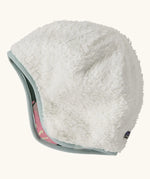 Patagonia recycled polyester baby cosy reversible beanie hat in hope blooms/fuzzy mauve showing a white fleece pile 