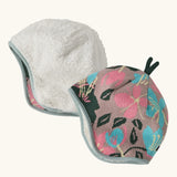 Patagonia baby cosy reversible beanie hat in hope blooms/fuzzy mauve showing a repeating knitted floral design and fleece pile 