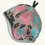 Patagonia baby cosy reversible beanie hat in hope blooms/fuzzy mauve showing a repeating knitted floral design 