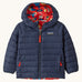 Patagonia little kids down hooded jacket in forest being sizzle red available at Babipur. A navy warm reversible jacket with a geometric on the reversible side. Features a a full length zip and 2 side pockets.
