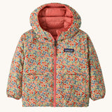Patagonia little kids down hooded jacket in tiny world/lichen green. A light warm reversible jacket in pale green a cute floral design. Features a a full length zip and 2 side pouch pockets